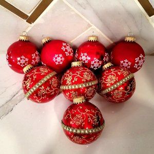 Vintage glass traditional red ornaments gold and white details and snowflakes